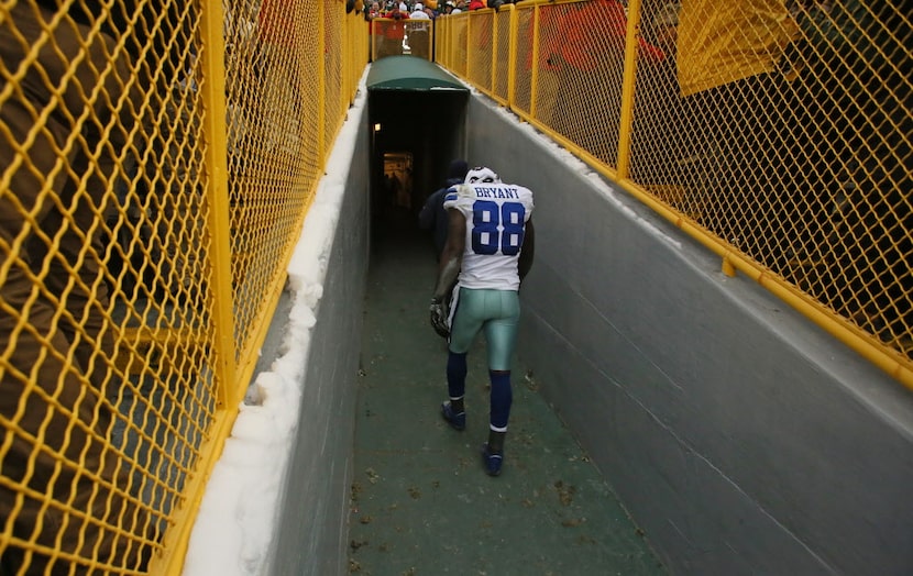 Cowboys wide receiver Dez Bryant walked disconsolately up the players' tunnel after the...