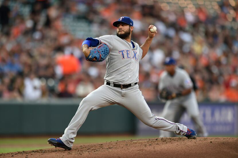 Texas Rangers pitcher Martin Perez delivers against the Baltimore Orioles in the first...