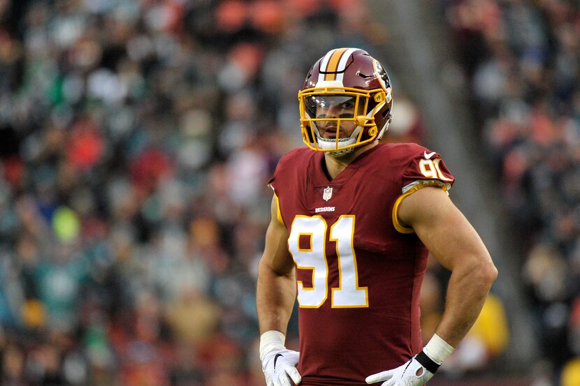 Washington Redskins outside linebacker Ryan Kerrigan stands on the field during an NFL...