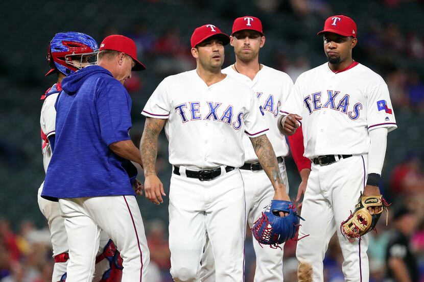 ARLINGTON, TX - SEPTEMBER 13:  Matt Bush #51 of the Texas Rangers walks off the mound after...