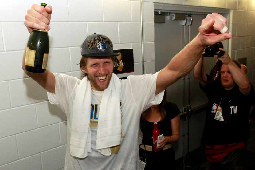 Dallas Maverick player Dirk Nowitzki celebrates after they won game six of the NBA Finals...