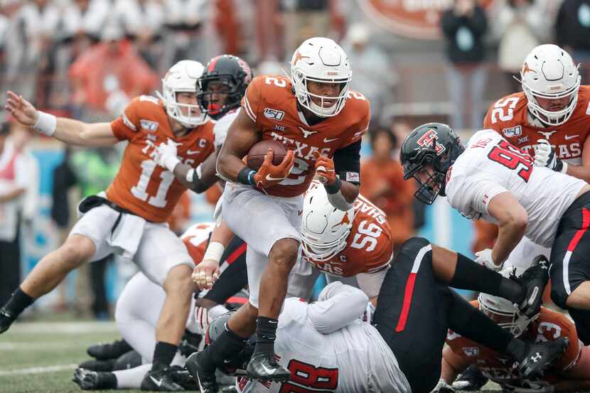 AUSTIN, TX - NOVEMBER 29:  Roschon Johnson #2 of the Texas Longhorns rushes for a touchdown...