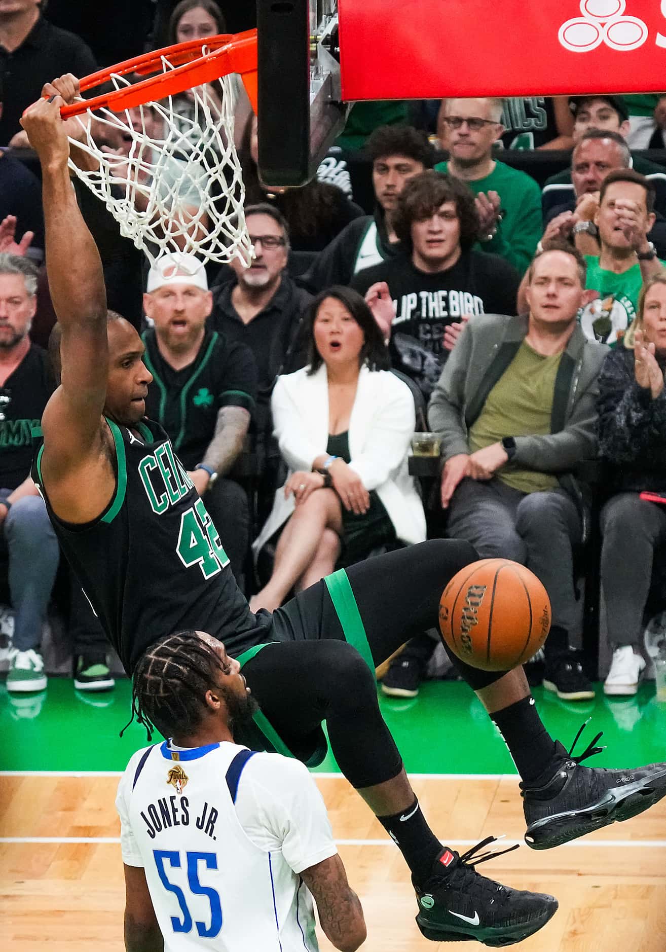 Boston Celtics center Al Horford (42) dunks the ball past Dallas Mavericks forward Derrick...