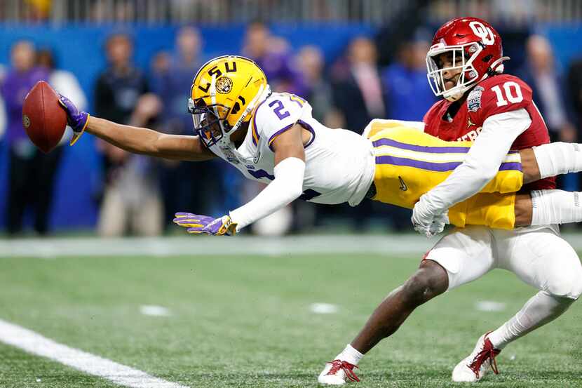FILE - LSU wide receiver Justin Jefferson (2) extends for a touchdown while Oklahoma safety...