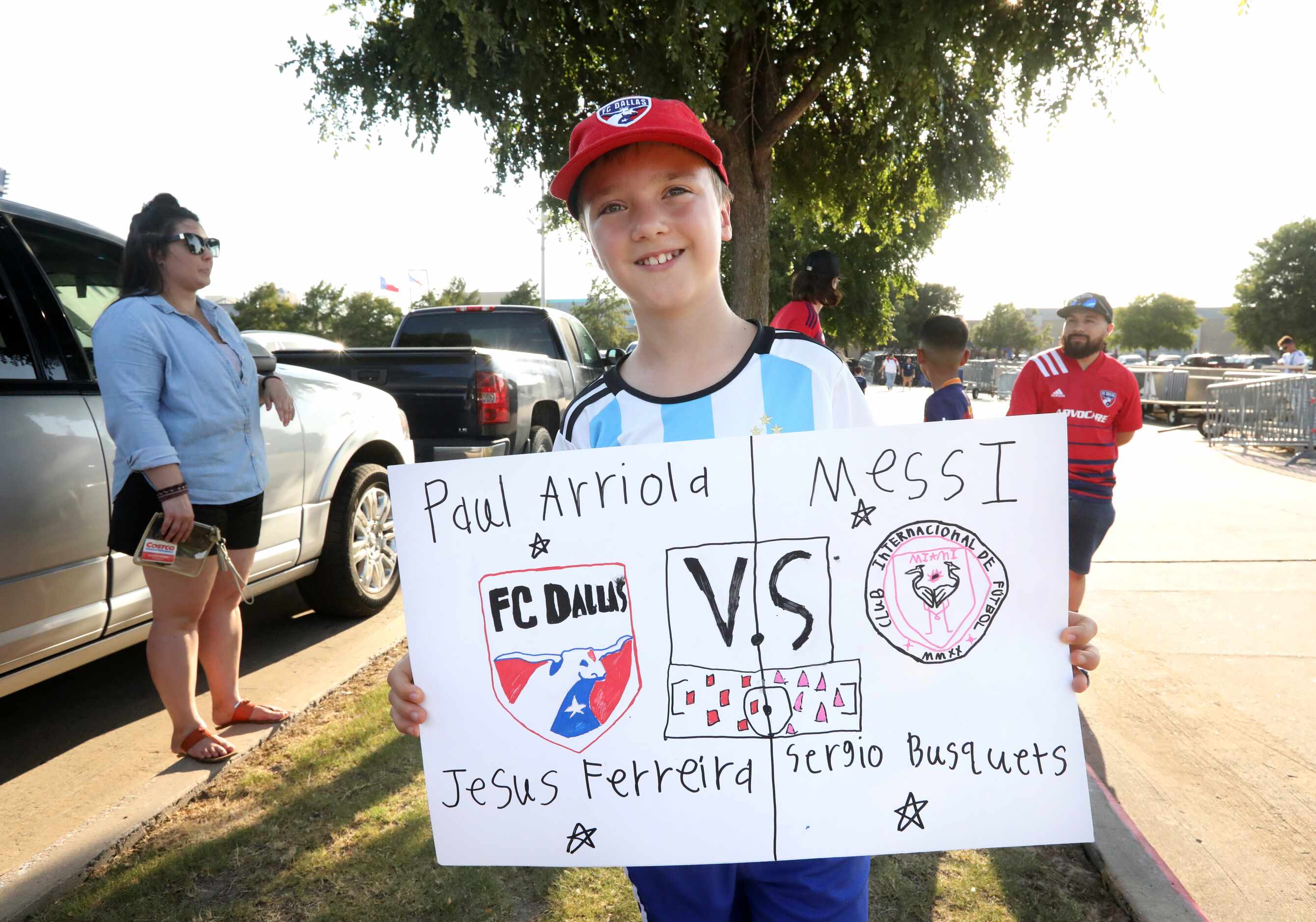 11-year-old Henri Fikins 11 holds a sign he made for the FC Dallas game at Toyota Stadium in...