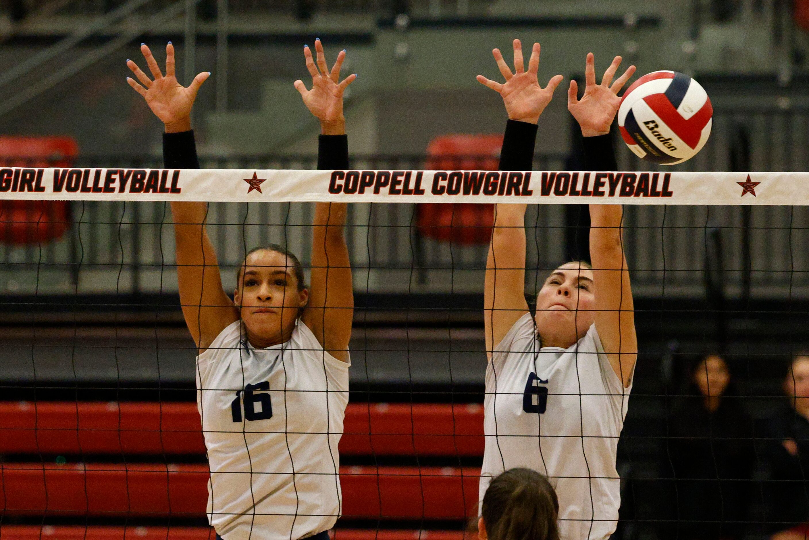 Flower Mound's Geli St. Laurent (16) and Flower Mound's Liz Goodspeed (6) try to block...