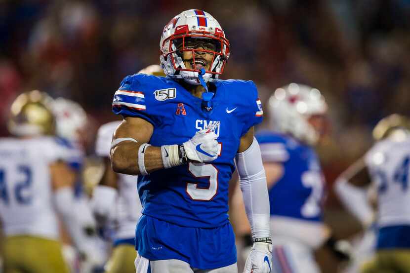 SMU Mustangs running back Xavier Jones (5) celebrates after scoring a touchdown in overtime...