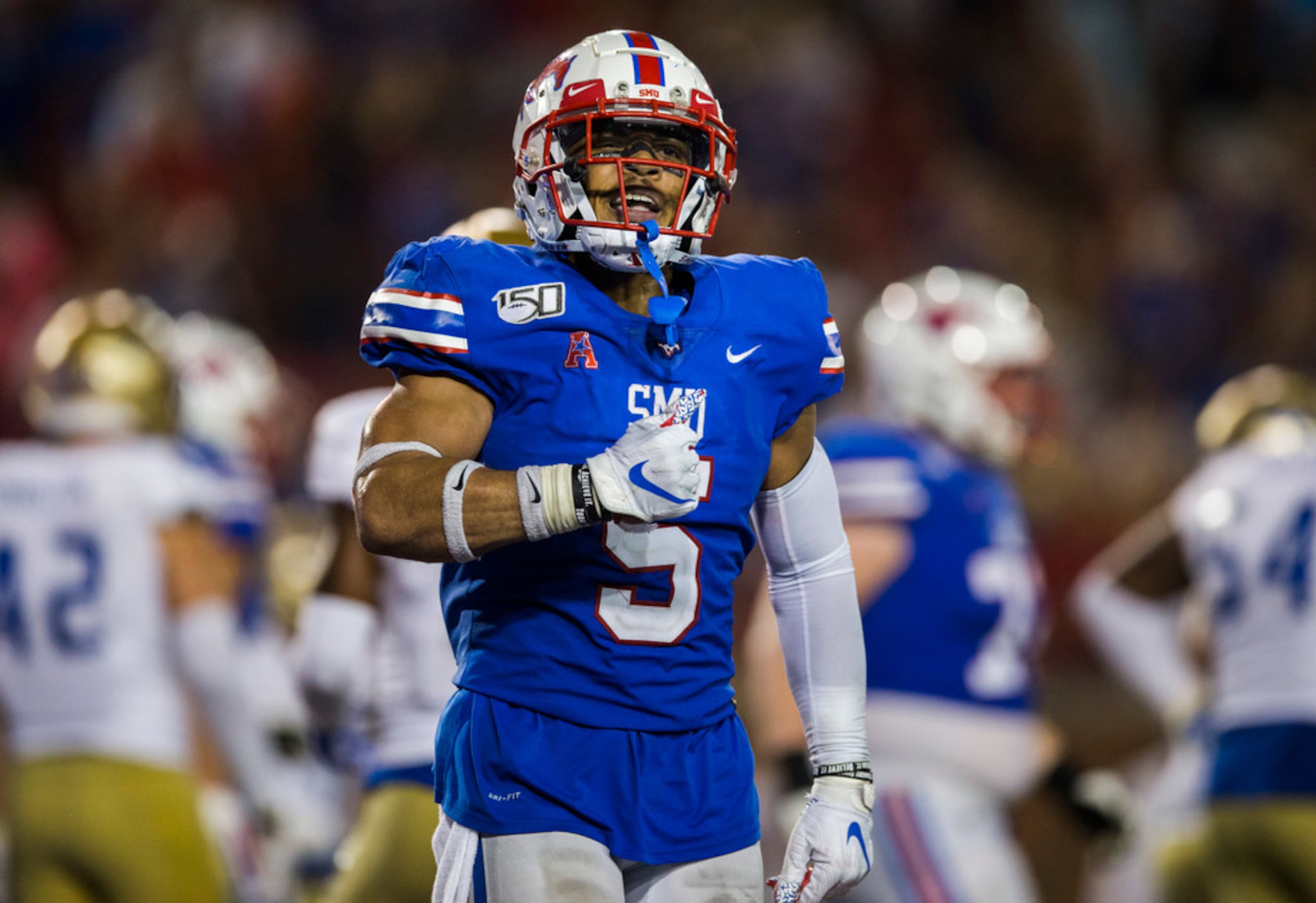 SMU Mustangs running back Xavier Jones (5) celebrates after scoring a touchdown in overtime...