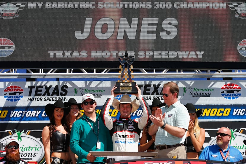 FORT WORTH, TX - APRIL 08:  Erik Jones, driver of the #20 GameStop/GAEMS Toyota, celebrates...