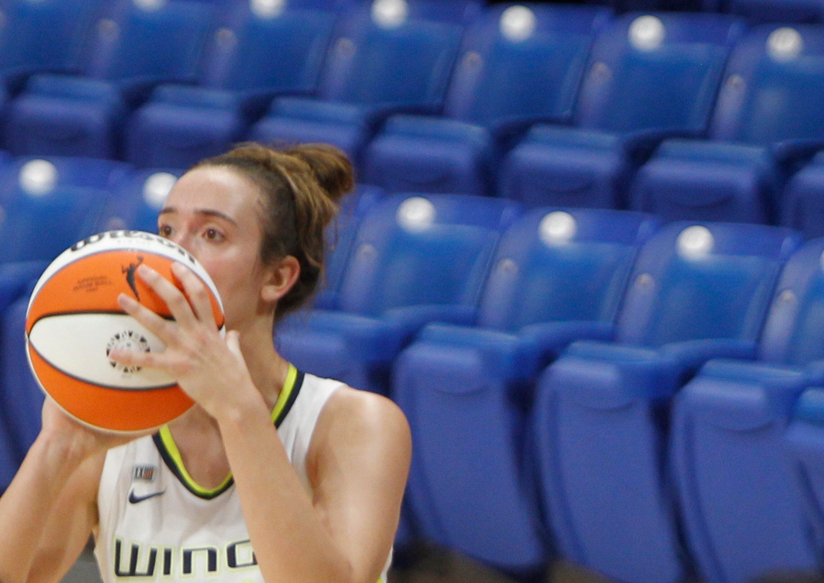 Dallas Wings guard Marina Mabrey (3) eyes the basket before launching an uncontested...