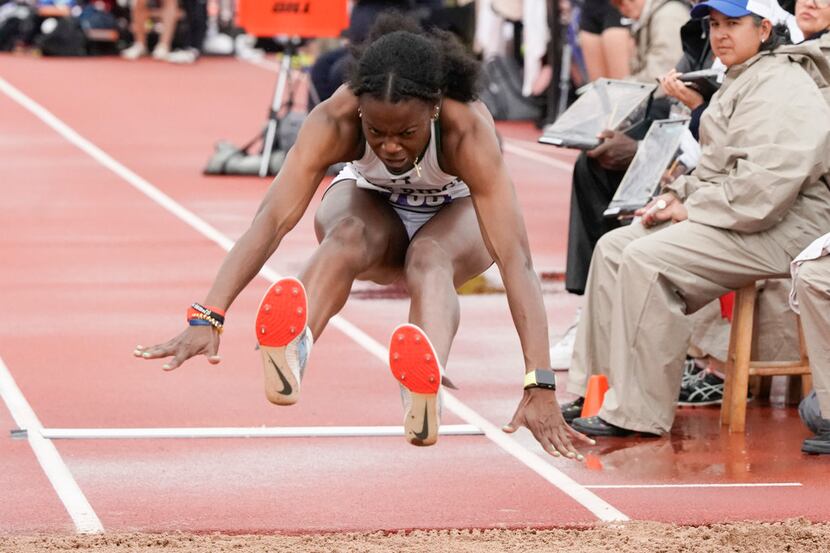 Jasmine Moore of Mansfield Lake Ridge leaps to first place in the 6A girls long jump with a...