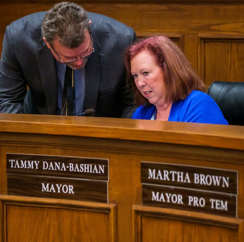 Mayor Tammy Dana-Bashian talks with City Manager Brian Funderburk after Rowlett officials...