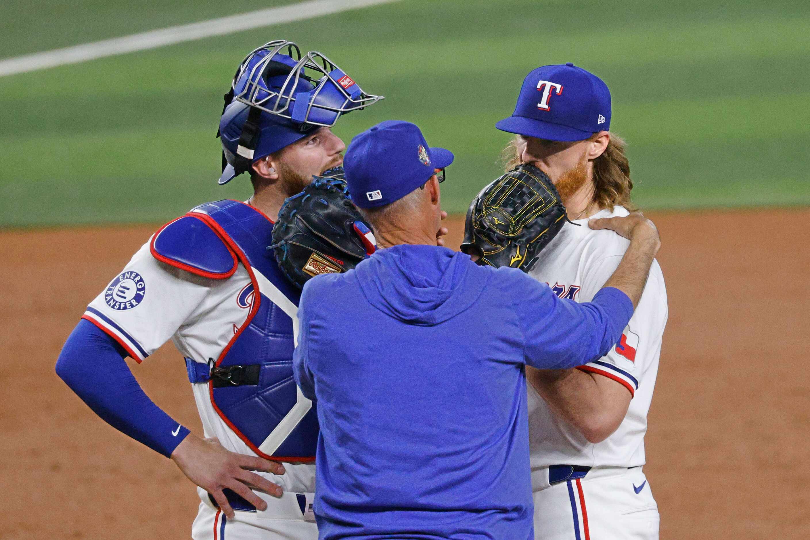 Texas Rangers pitching coach Mike Maddox, center, talks with Texas Rangers pitcher Jon Gray...