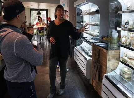 Chef Tiffany Derry speaks with customers at Uptown Urban Market in Dallas, Texas on Friday,...