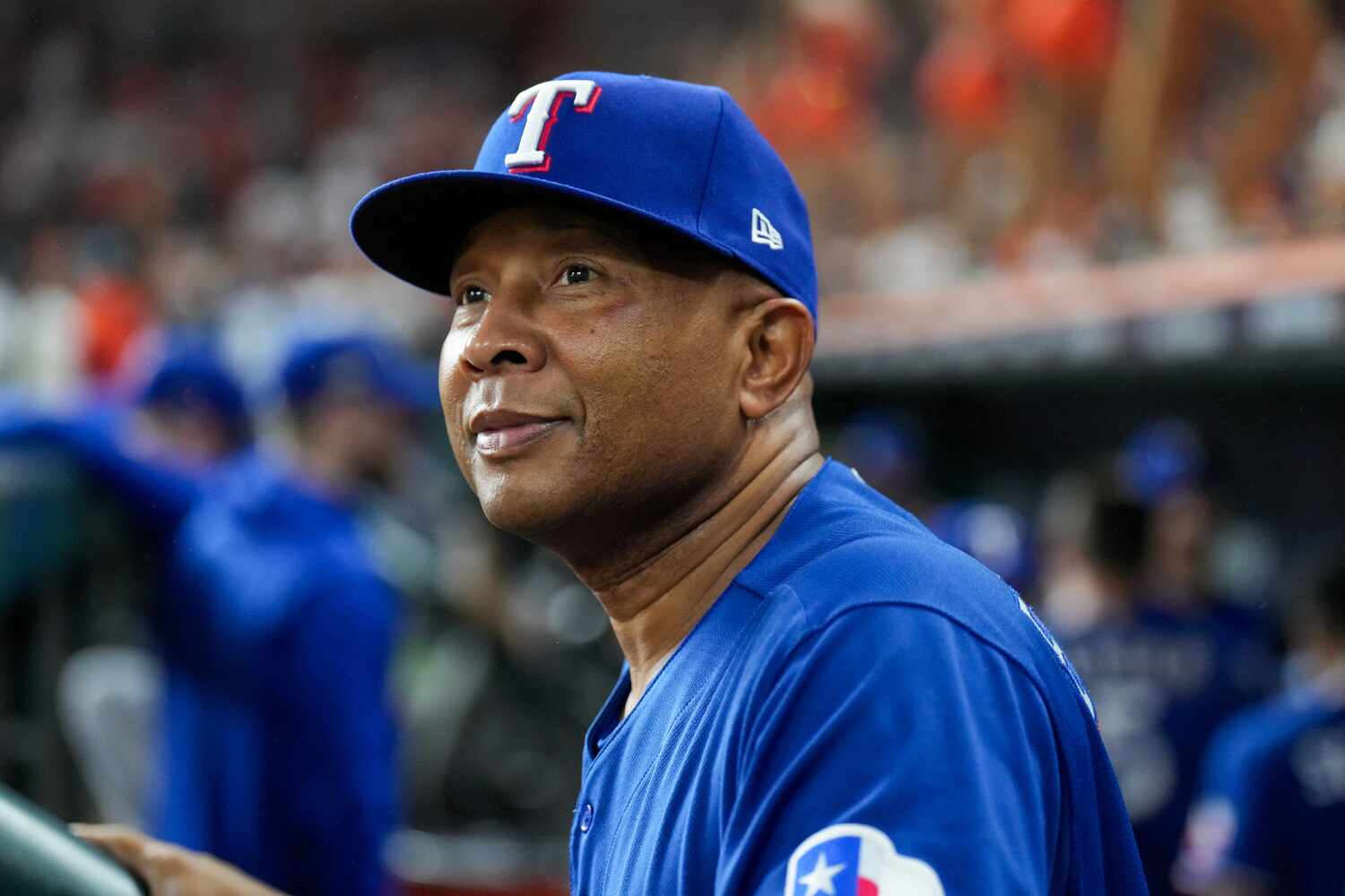 Texas Rangers third base coach Tony Beasley (27) looks on before play against the Houston...