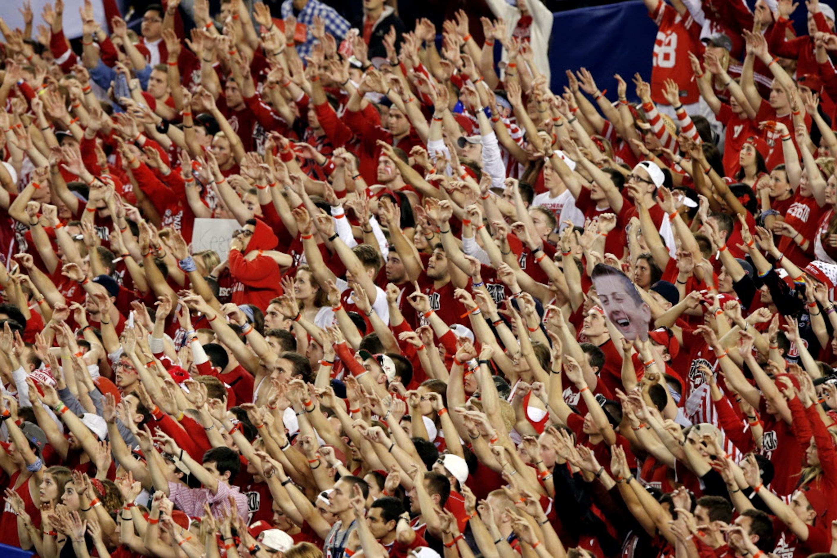 Wisconsin Badgers fans cheer during the second half of their NCAA Final Four loss to the...