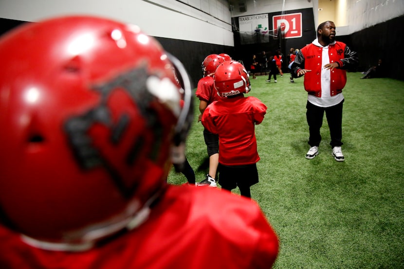 Tevar Watson coaches during a Hamilton Park Bobcats youth football league practice.