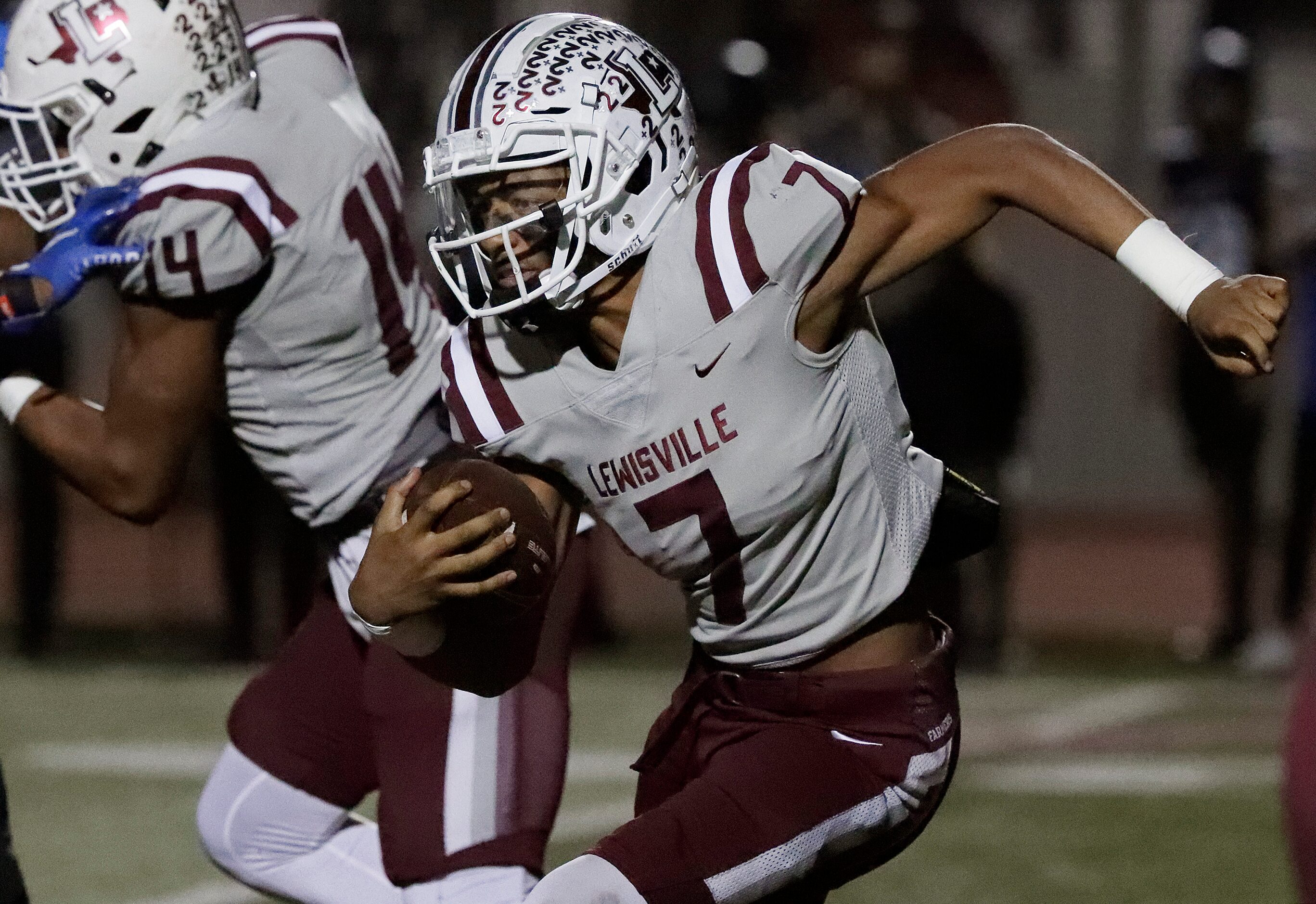 Lewisville High School quarterback Ethan Terrell (7) runs the football during the first half...