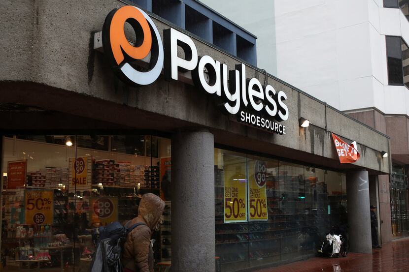 SAN FRANCISCO — A pedestrian walks by a Payless Shoe store on Feb. 8. Payless is preparing...