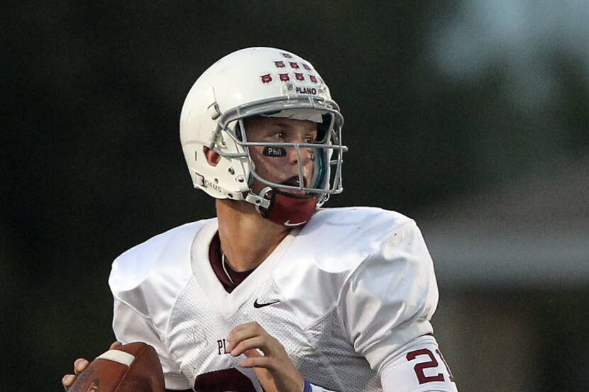 Plano quarterback Richard Lagow (21) against Naaman Forest in High School Football action at...