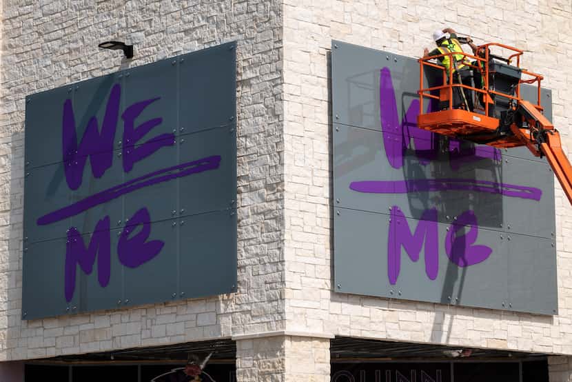 Workers installed a sign outside the health and wellness center at Paul Quinn College on...