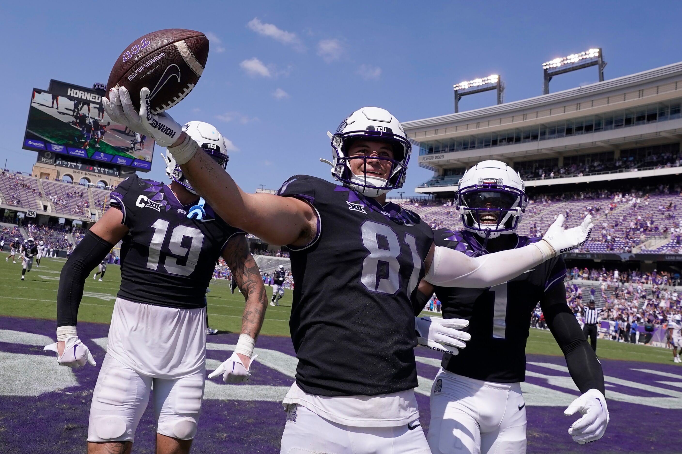 TCU tight end Chase Curtis (81) celebrates his touchdown with teammates Jared Wiley (19) and...