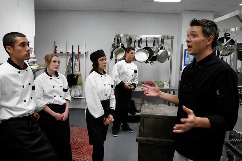  Cody Hayes, chef instructor of culinary arts, gives directions to his students. Rockwall...