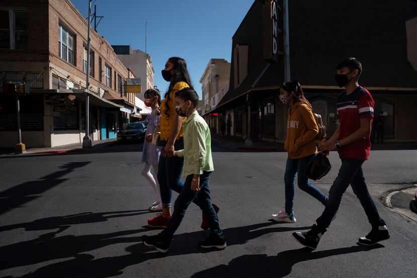 Erika Isabel Medina, 32, and her children made their way to downtown stores in Laredo on...