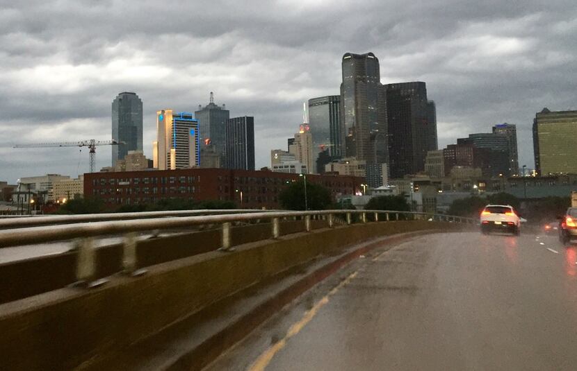 Storm clouds and rain arrive over downtown Dallas early Tuesday morning, August 27, 2019 in...