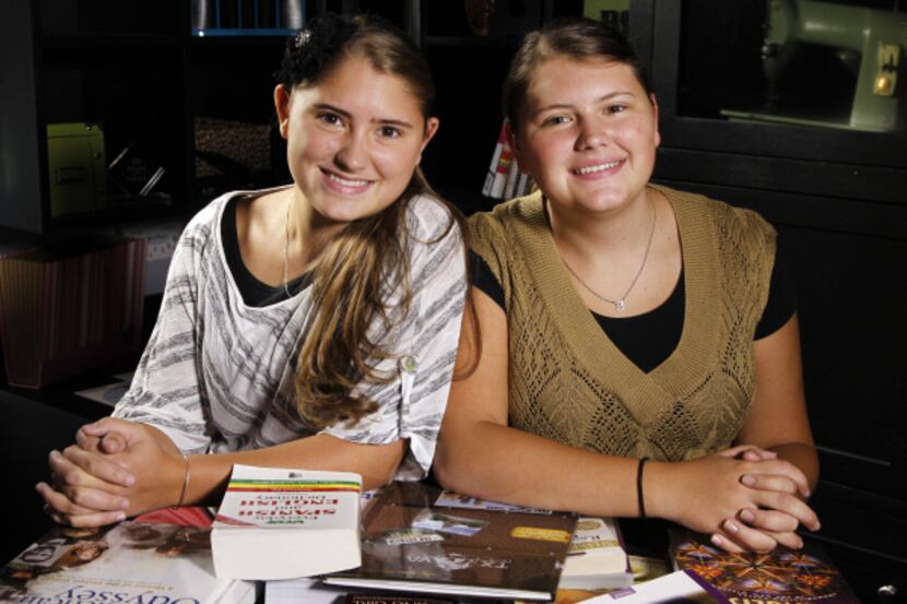 Sisters Blair (left) and Ashley Roy take all of their high school classes online in their...
