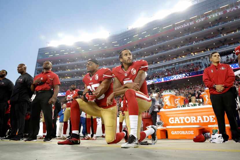 In this Sept. 12, 2016, file photo, San Francisco 49ers safety Eric Reid (left) and...