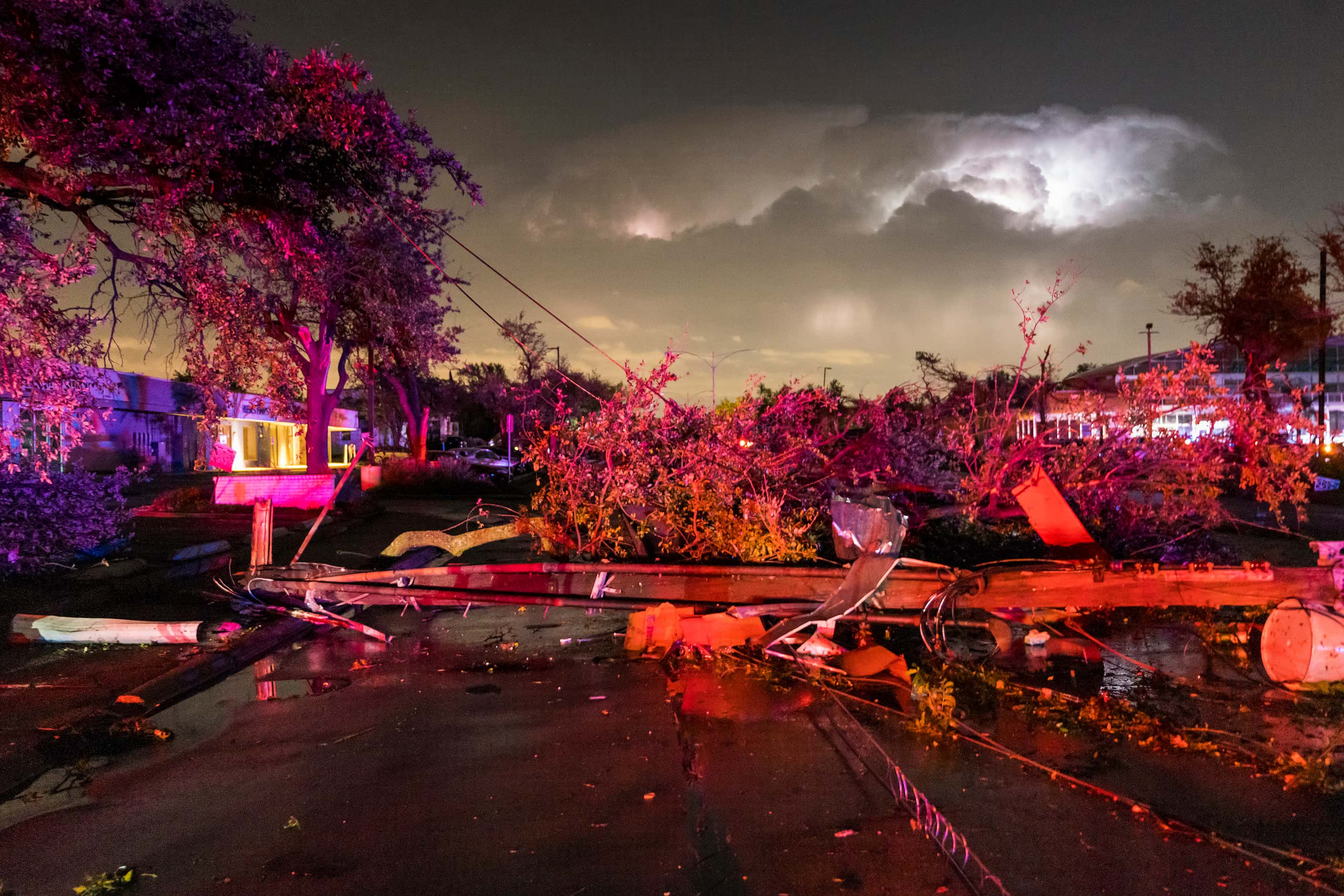 Downed power lines and trees block Royal near the intersection at Preston from tornado...