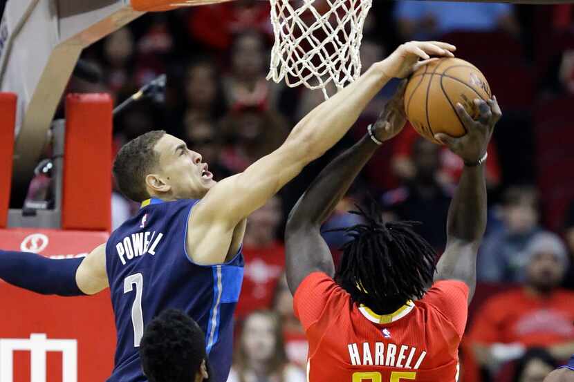 Dallas Mavericks' Dwight Powell (7) blocks a shot by Houston Rockets' Montrezl Harrell (35)...