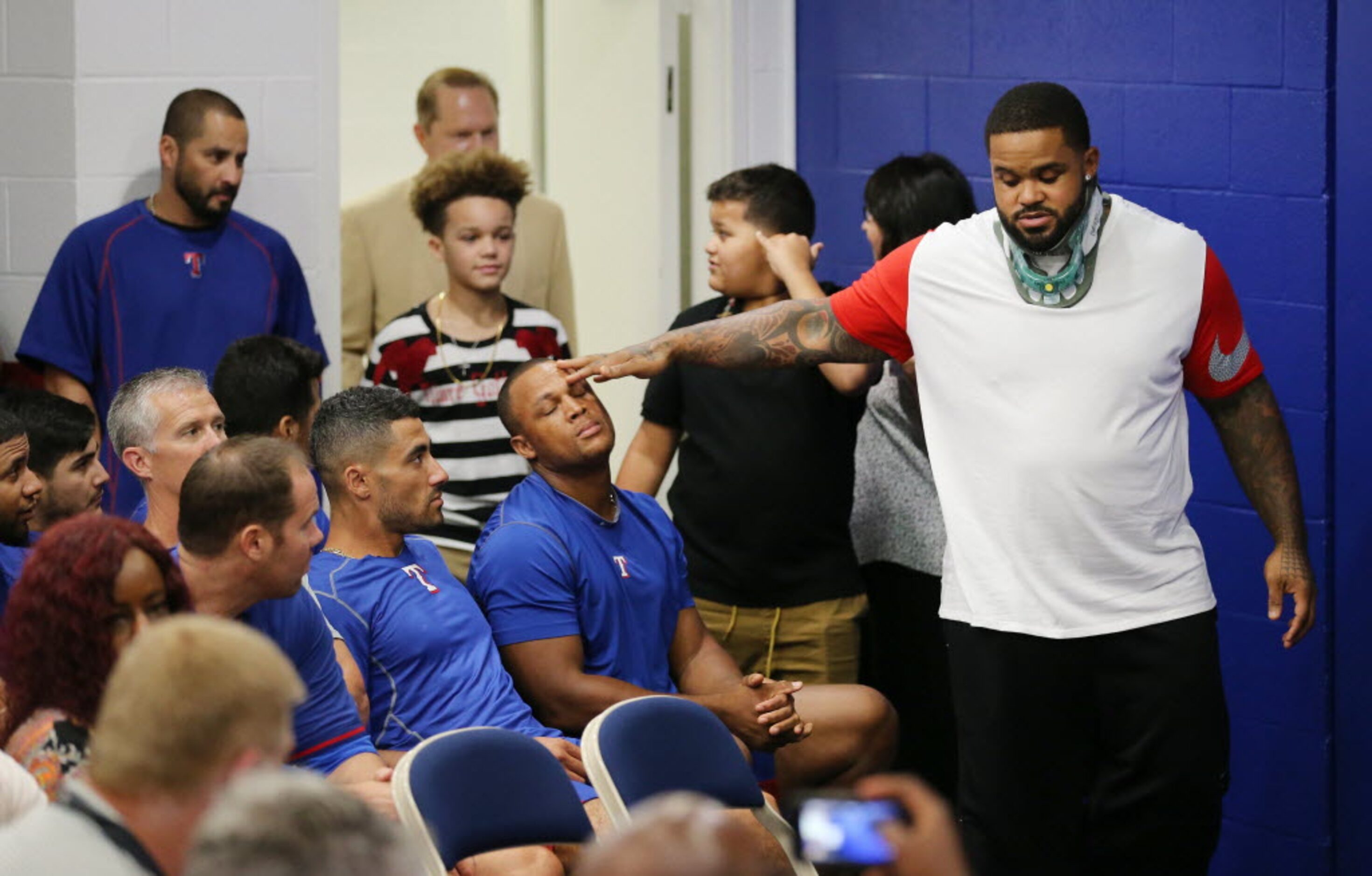 Texas Rangers designated hitter Prince Fielder jokes with third baseman Adrian Beltre before...