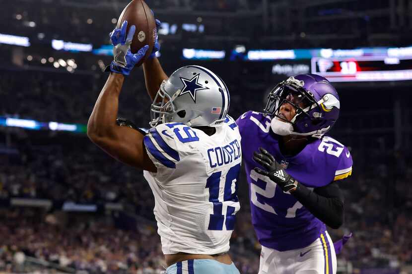 Dallas Cowboys wide receiver Amari Cooper (19) comes down with the game-winning tou