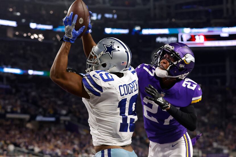 Dallas Cowboys wide receiver Amari Cooper (19) comes down with the game-winning touchdown in...