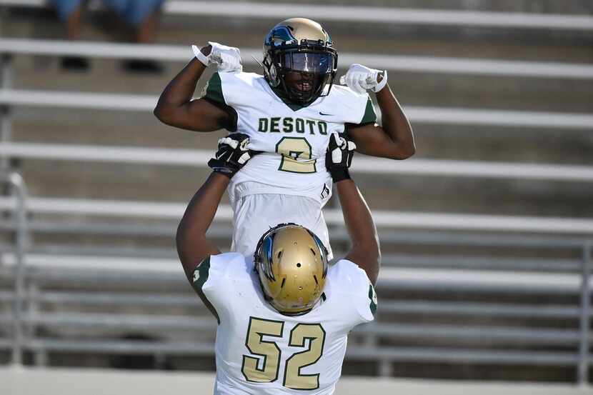 DeSoto senior wide receiver Jamal Brown (2) scores a touchdown and celebrates with DeSoto...