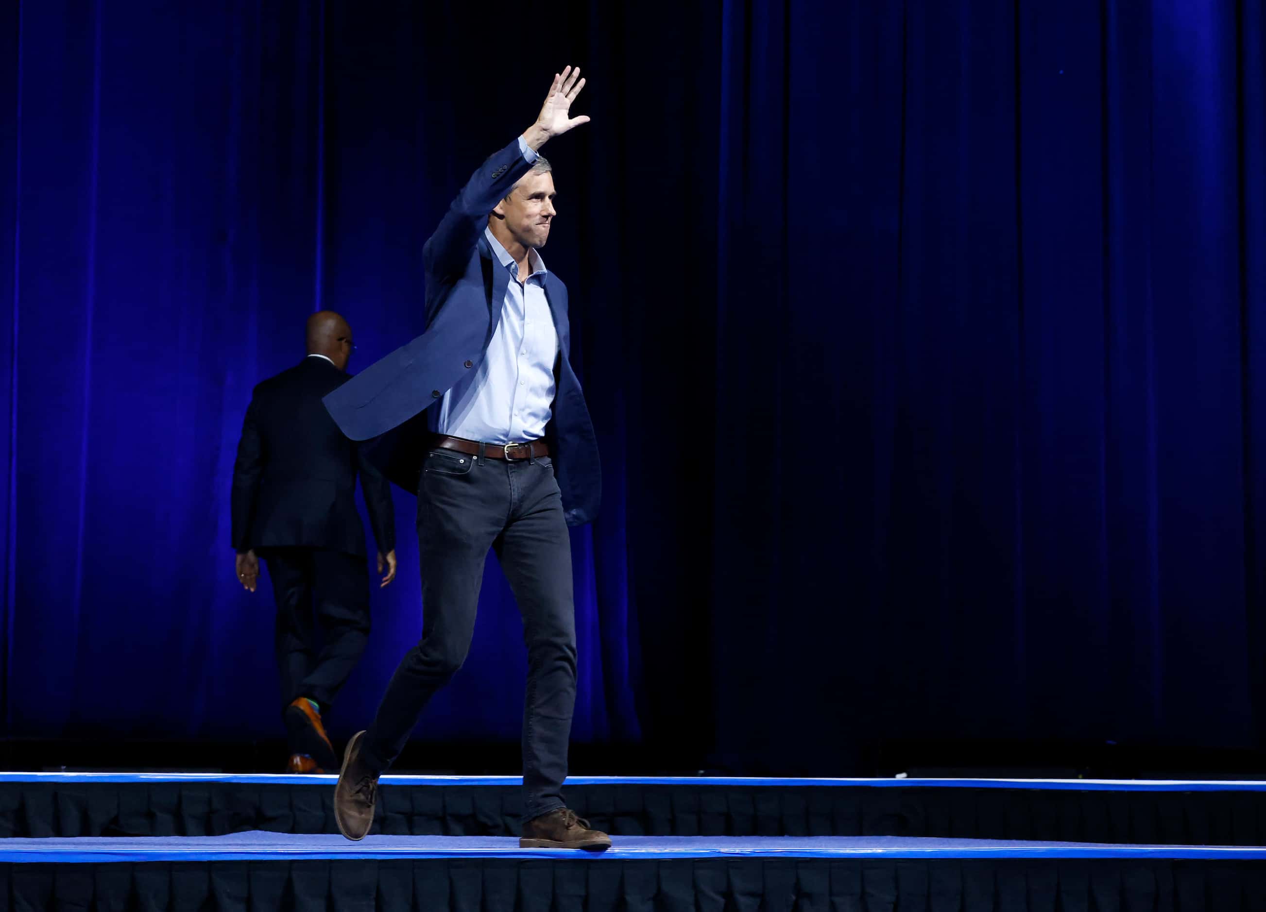 Democratic gubernatorial challenger Beto O'Rourke walks on-stage to deliver his speech to...