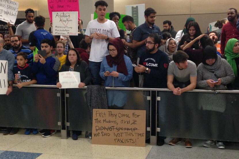 Hundreds protested in Terminal D at DFW International Airport on Saturday night. (Robert...