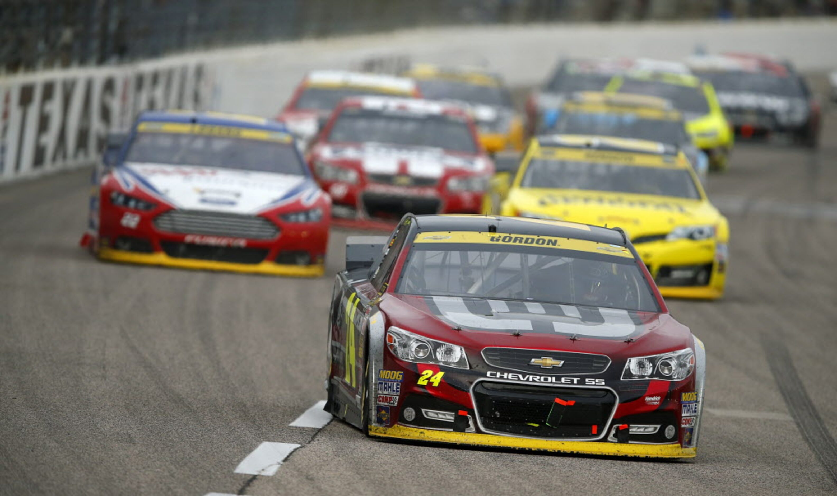 Sprint Cup Series driver Jeff Gordon (24) leads a pack of cars during the AAA Texas 500 at...