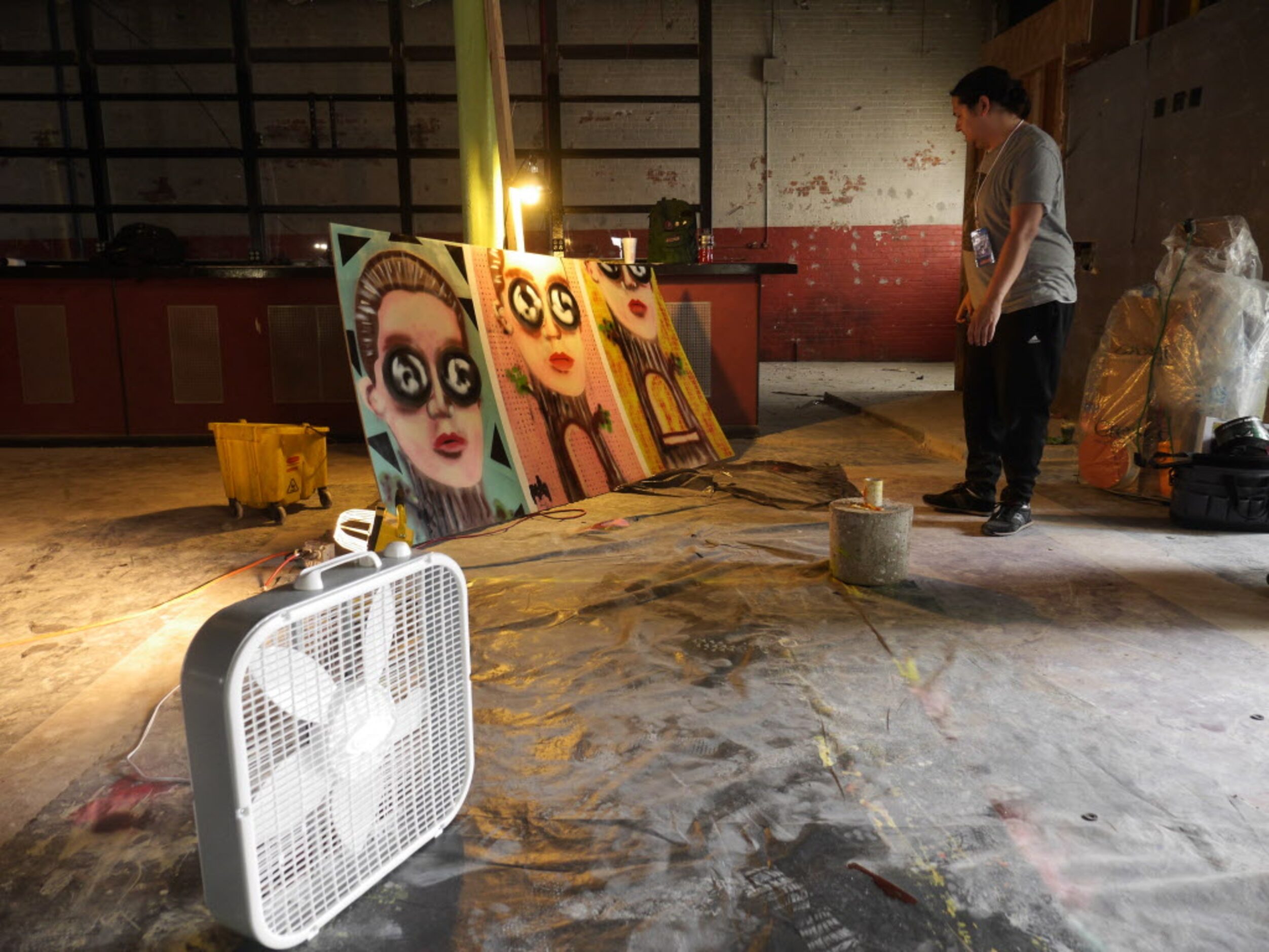 Mike Moffatt looks over his mural, titled, "Look Out Hill'"at the TunnelVisions Mural...