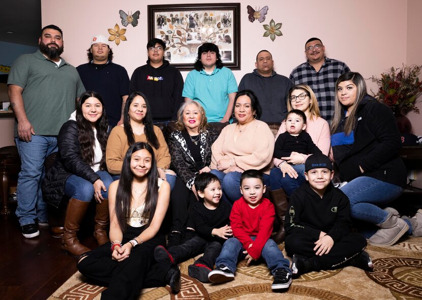 Anita Arango (center in leopard print jacket), wife of Alex Arango, an officer with the...