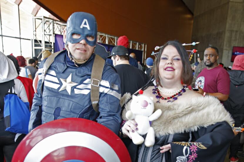 Chris Clayton dressed as Captain American while his wife, Marci Clayton, dressed as Lulu...