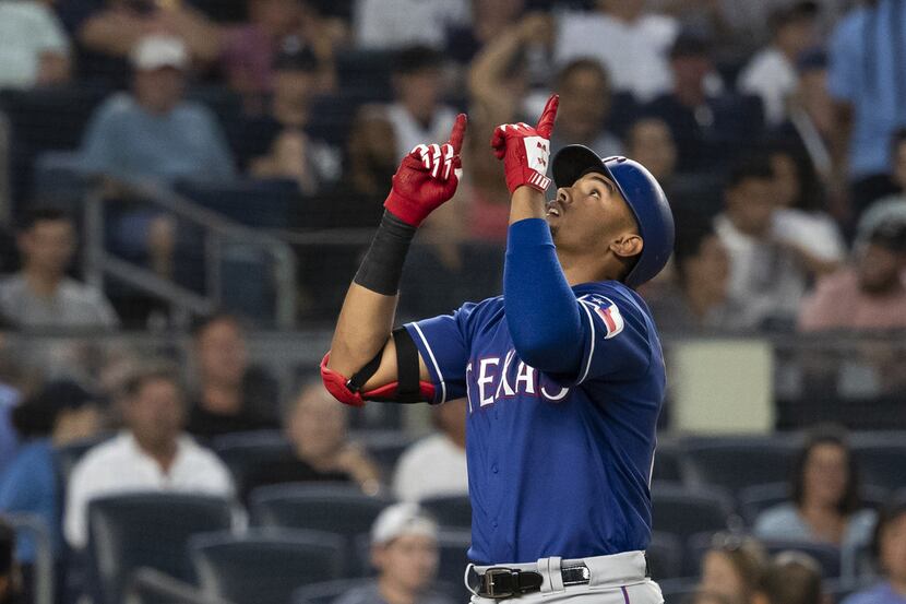 NEW YORK, NY - AUGUST 10: Ronald Guzman #67 of the Texas Rangers celebrates at home base...