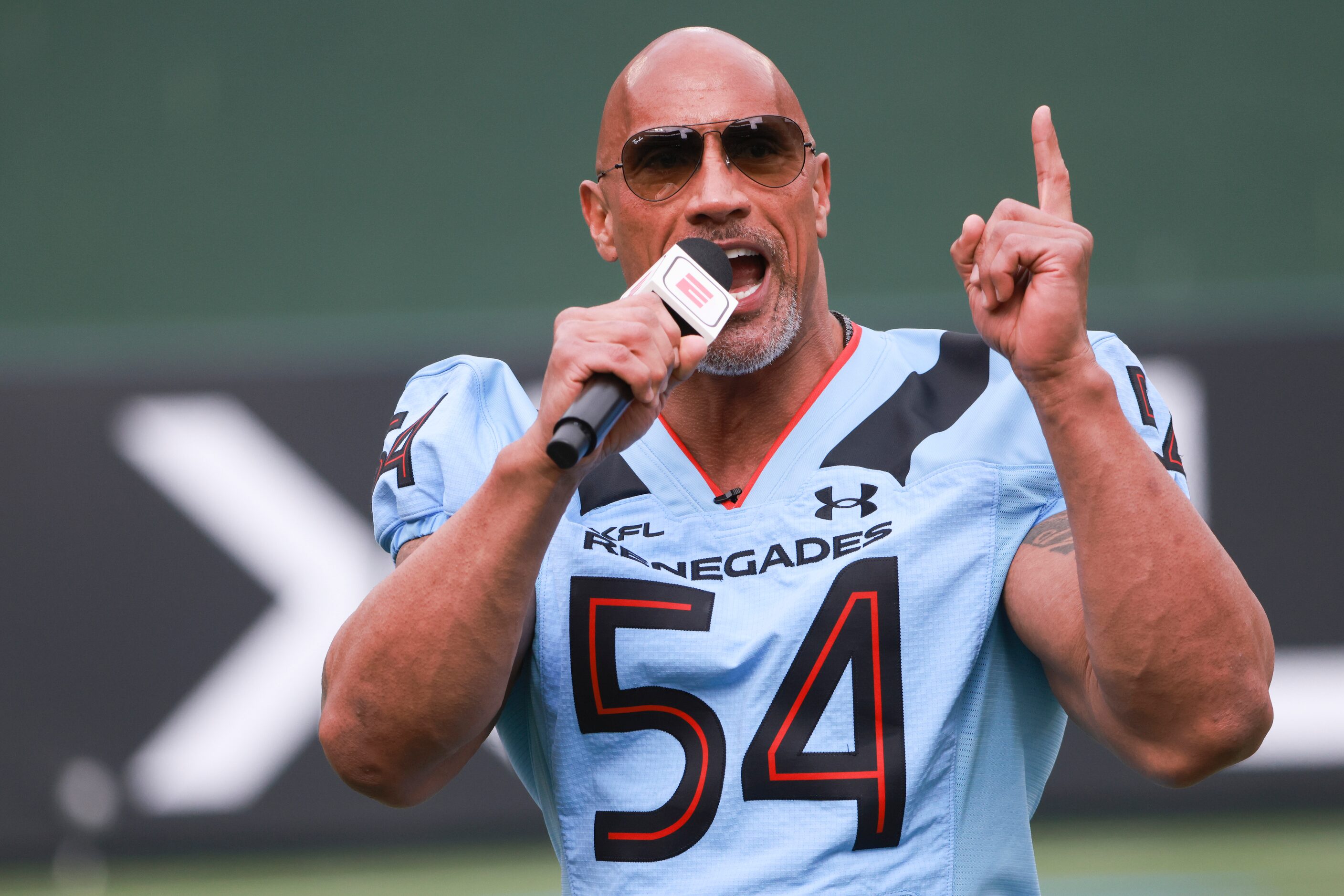 Dwayne “The Rock” Johnson hypes up the Arlington Renegades and crowd before the game at...