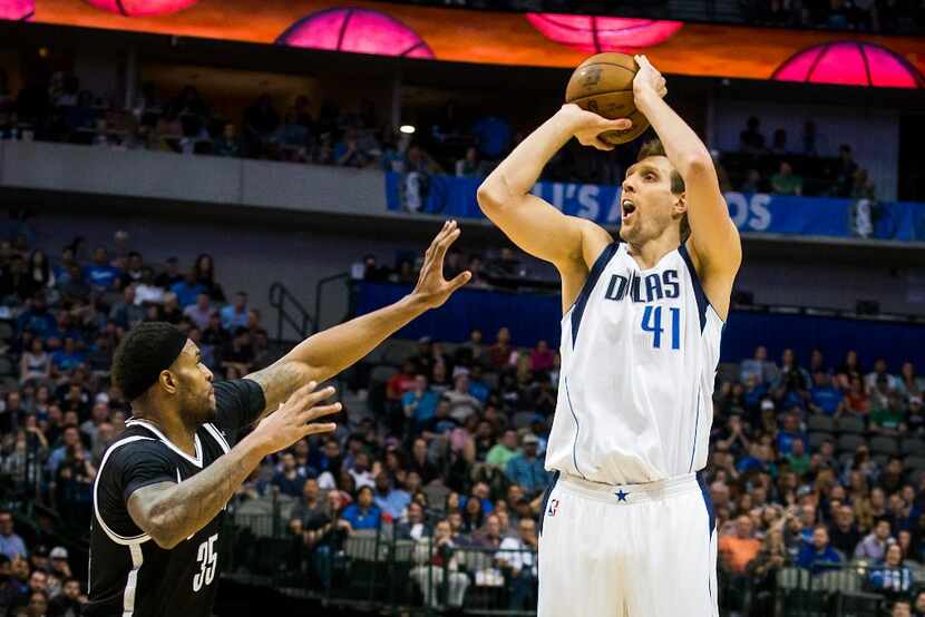 Dallas Mavericks forward Dirk Nowitzki (41) shoots over Brooklyn Nets forward Trevor Booker...