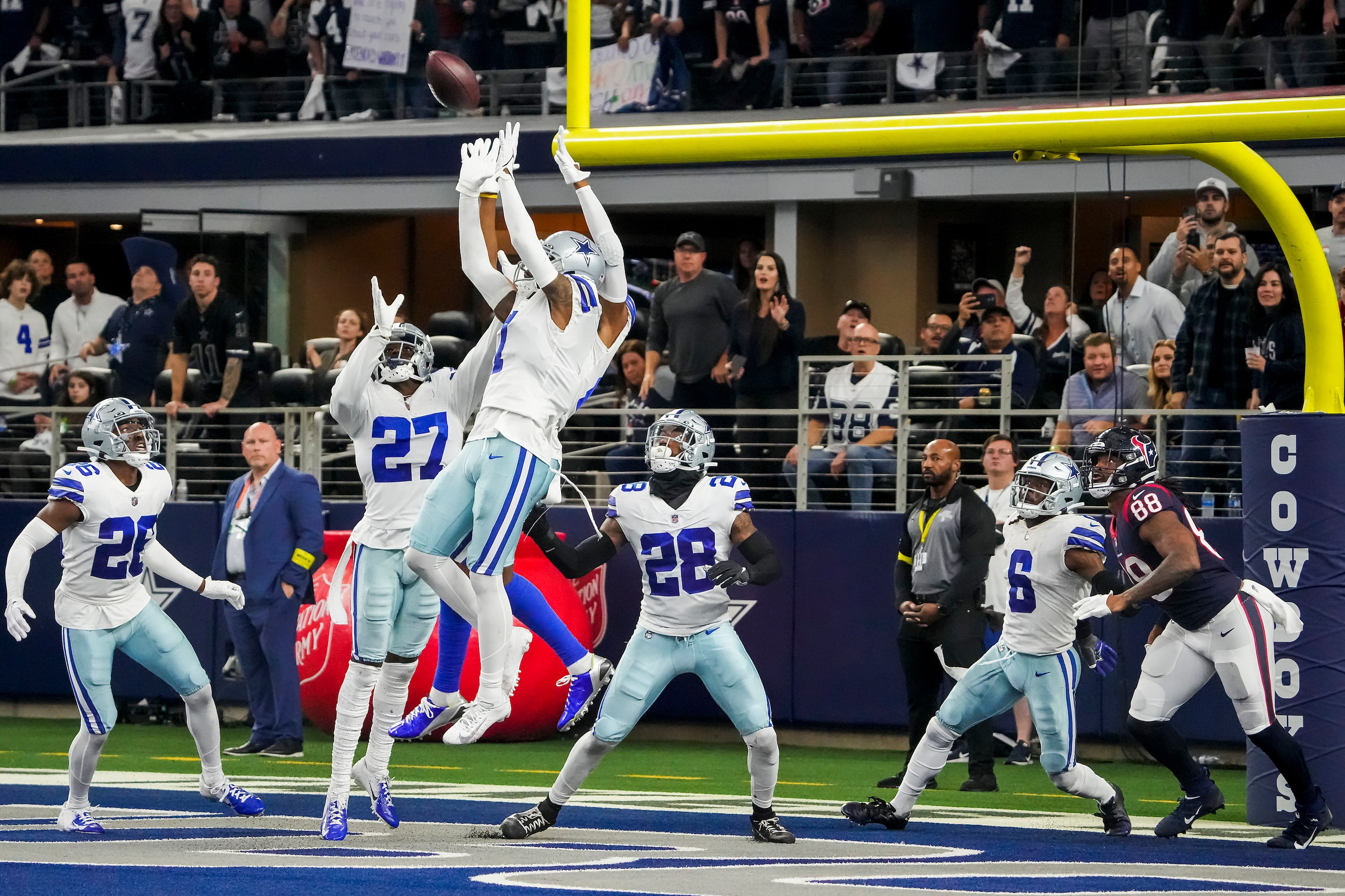 Dallas Cowboys defenders go up for a hail mary pass that was intercepted by safety Israel...