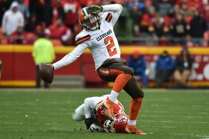 KANSAS CITY, MO - DECEMBER 27: Johnny Manziel #2 of the Cleveland Browns fights his way out...