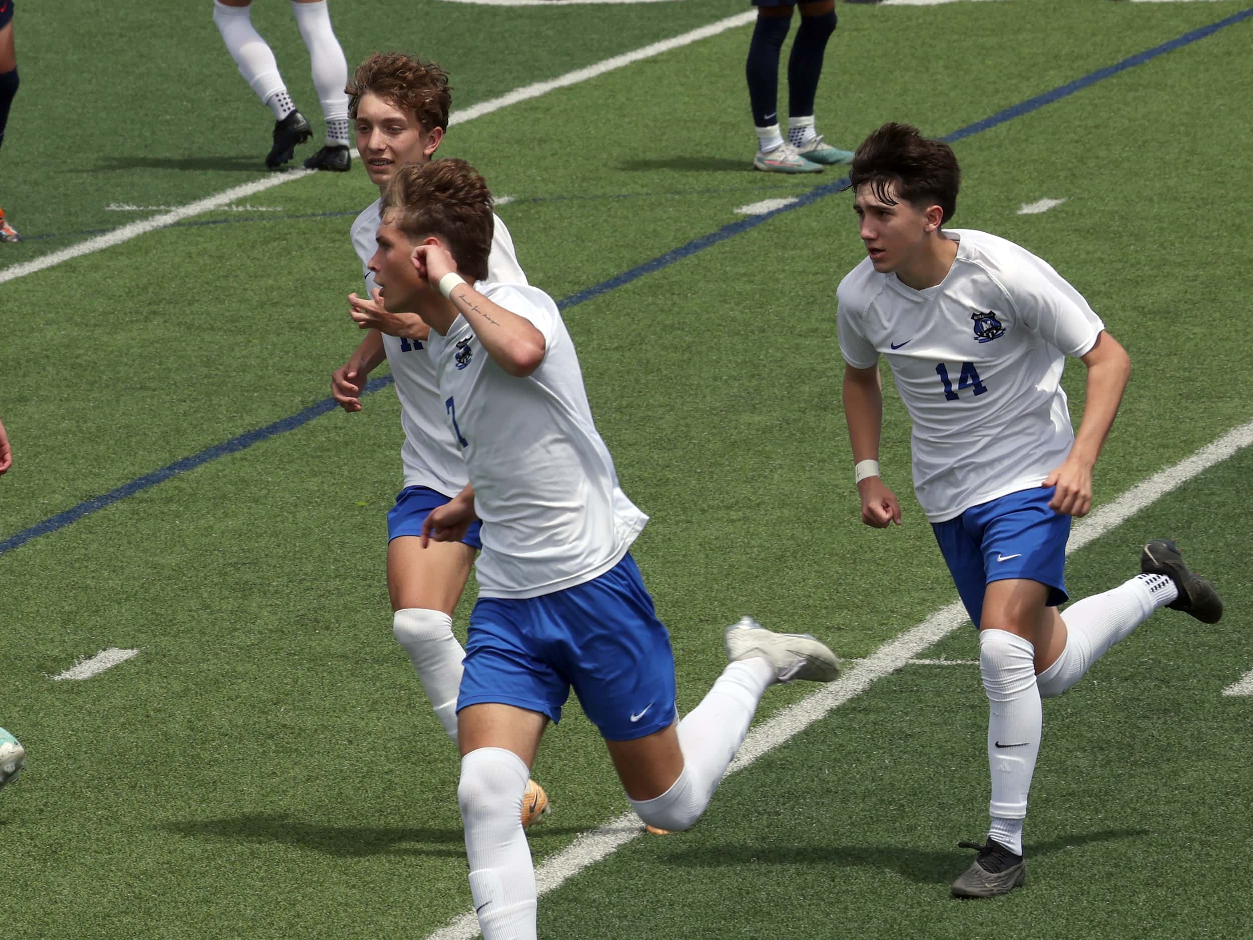  Midlothian midfielder Caden Naizer (7) , center, gestures toward fans in the stands as they...