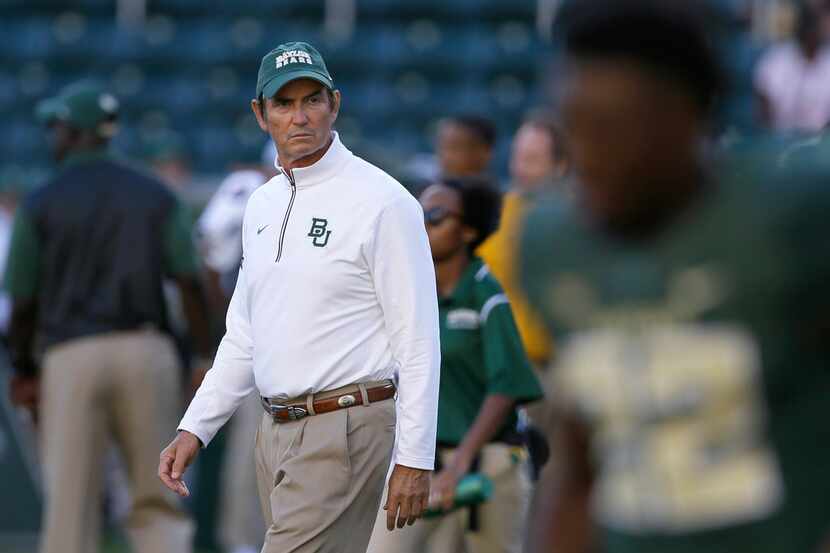 FILE - In this Sept. 12, 2015, file photo, Baylor coach Art Briles walks the field before...